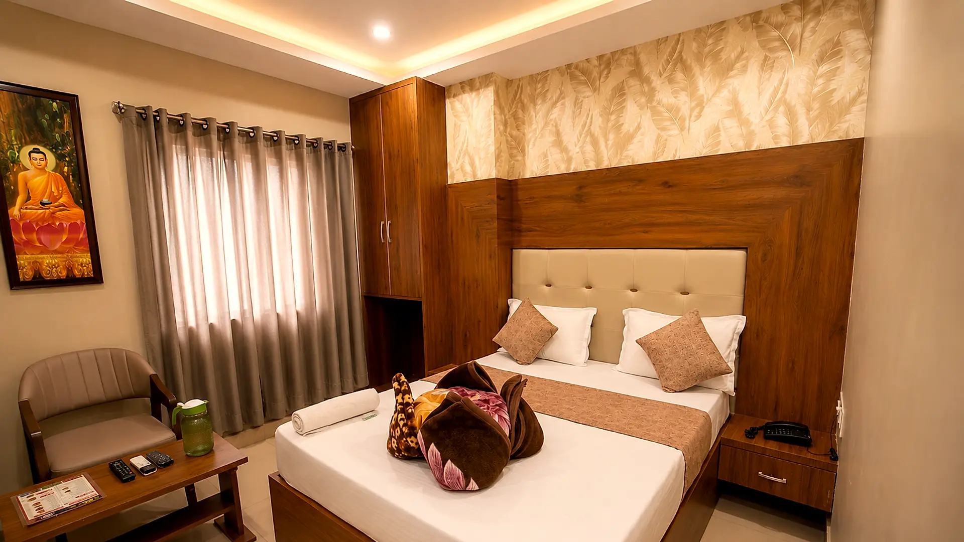 Premium Super Deluxe Room 310 at Hotel Siddhi Vinayak, Jodhpur — full room with bed, wardrobe, curtains and seating